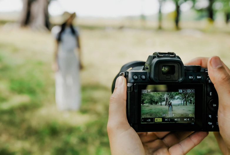 Out of focus person being photographed with the new Nikon Z50 II